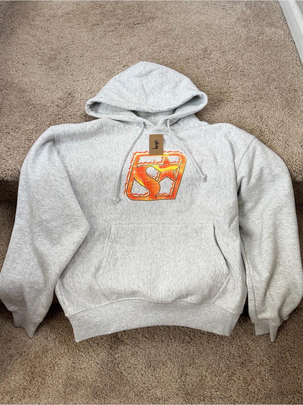 Stussy Light Gray Hoodie with Orange Logo Graphic